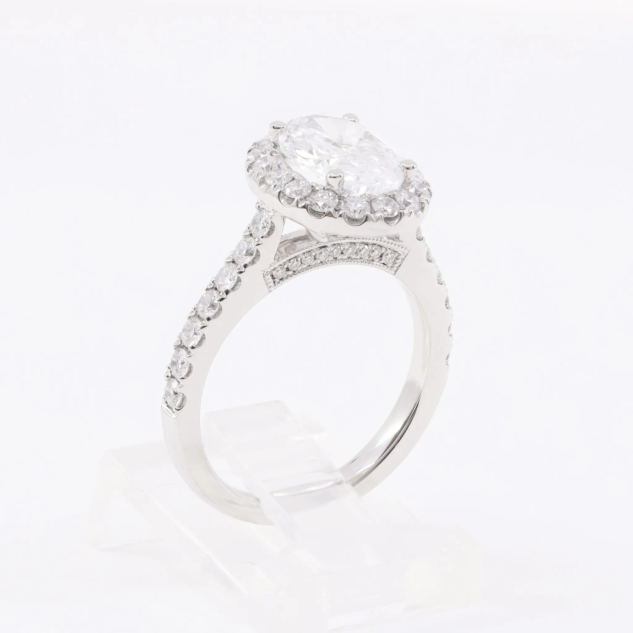 PLATINUM 2.00CT OVAL-CUT DIAMOND ENGAGEMENT RING WITH DIAMOND HALO 0.83CTW